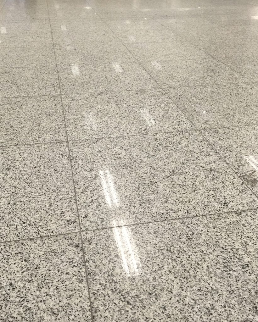 high-angle-view-light-reflecting-tiled-floor-building